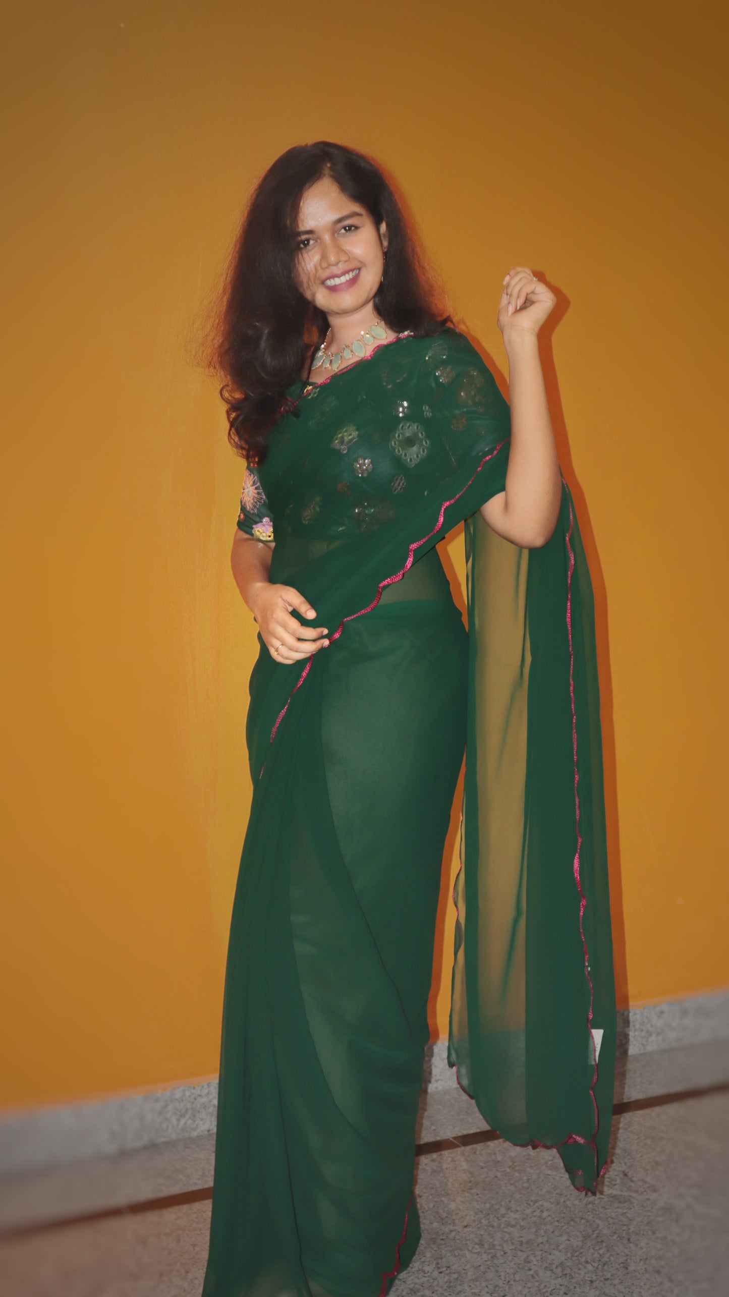 "Elegant bottle green georgette saree with stitched embroidery worked blouse