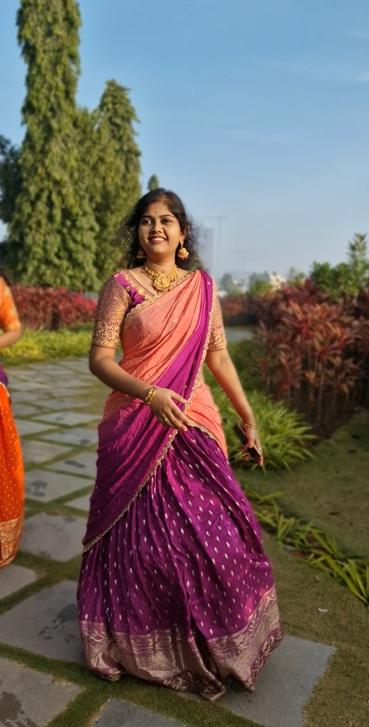 A bright Purple lehenga with golden motifs and a radiant golden border, paired with a matching running blouse (unstitched for a perfect custom fit).